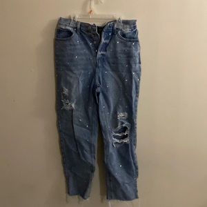 Light washed jeans with gems and cropped on bottoms